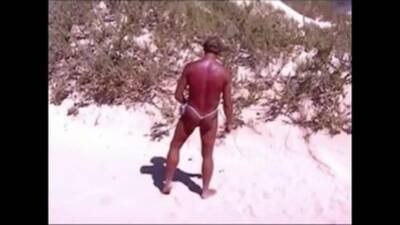 Tanned guy on beach in tiny string thong (temporarily!) - boyfriendtv.com